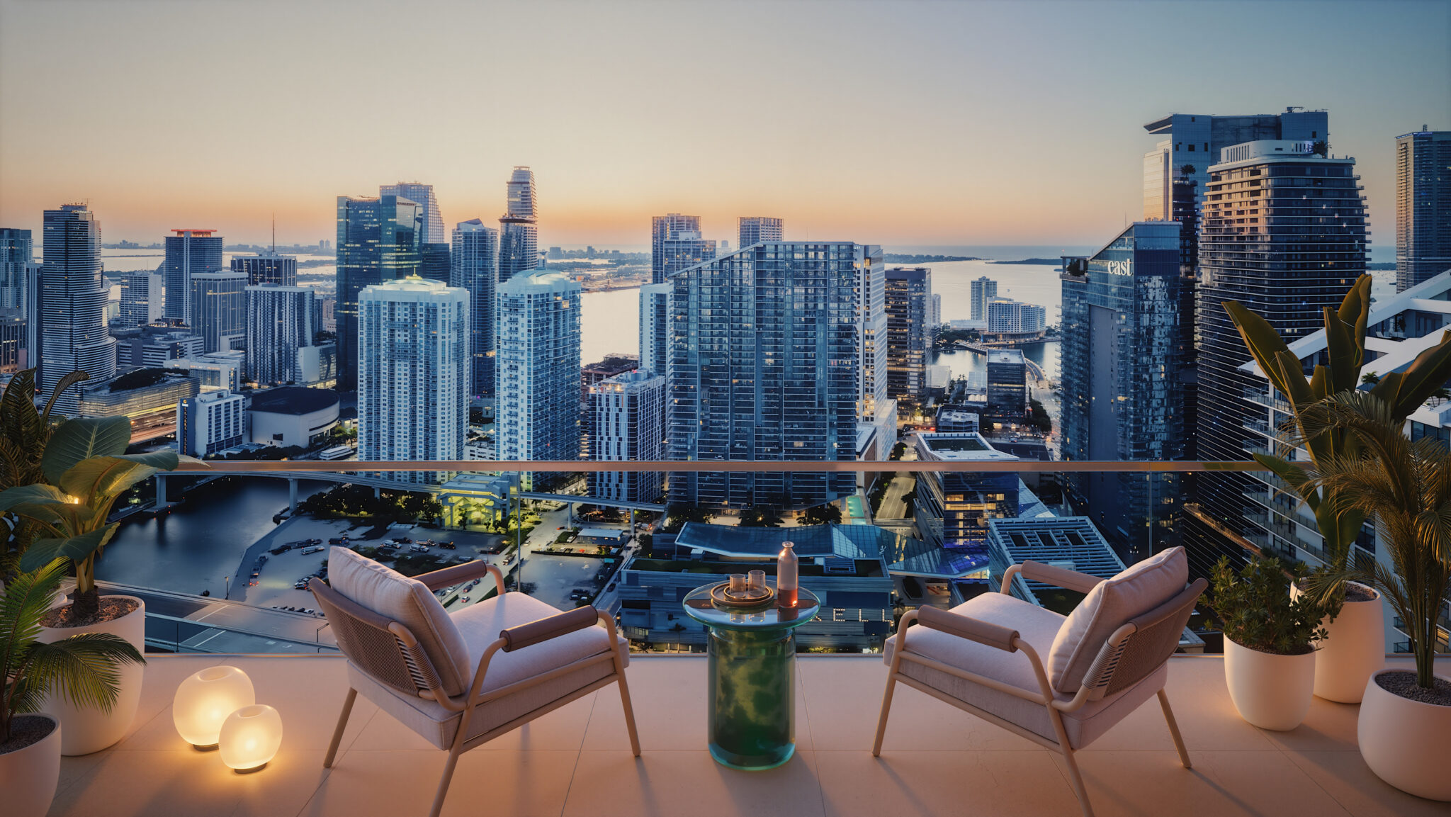 Rendering of a residence balcony at The Standard Residences overlooking the Brickell skyline and Miami River at dusk