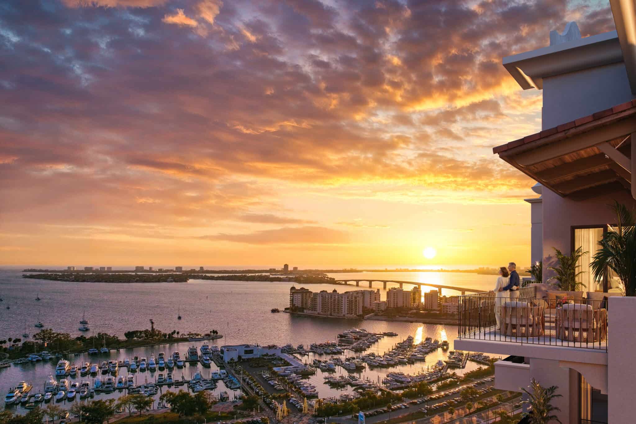Rendering of the view from a Mira Mar Sarasota balcony over Sarasota Bay at sunset