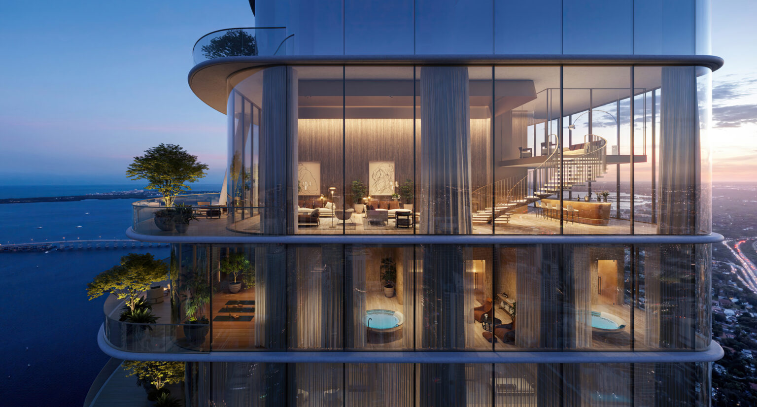 Rendering of the upper floors of 1428 Brickell glowing at dusk above Biscayne Bay
