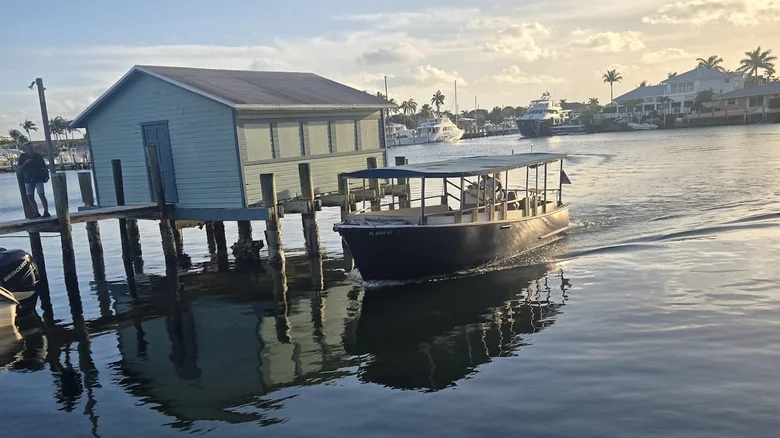 Arriving at Cap's Place by boat