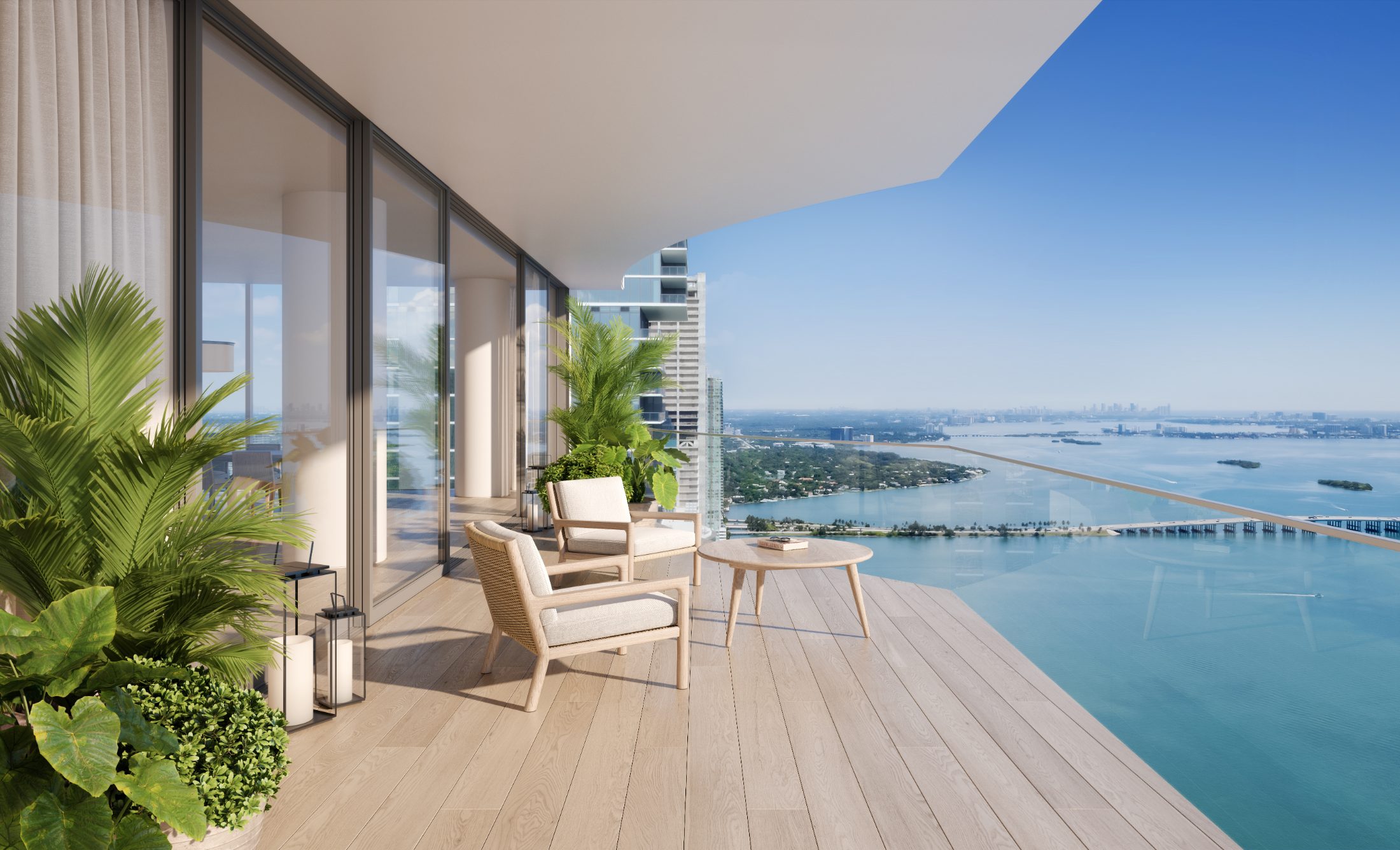 Rendering of a deep terrace with lounge seating and views over Biscayne Bay at EDITION Residences Miami Edgewater